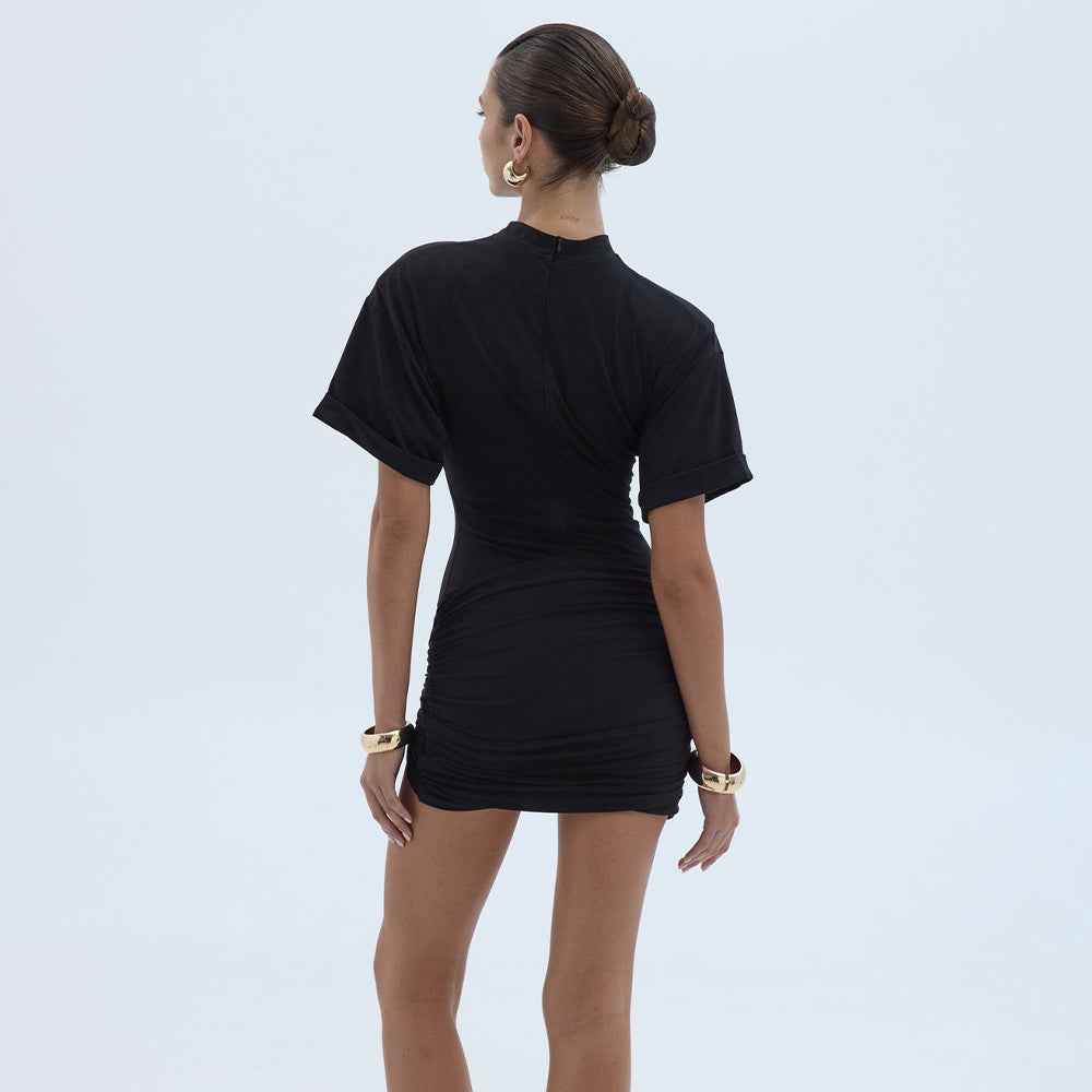 MRC STORE crew-neck pleated high-waist sheath dress, elegant and stylish, shown in a natural seated pose.