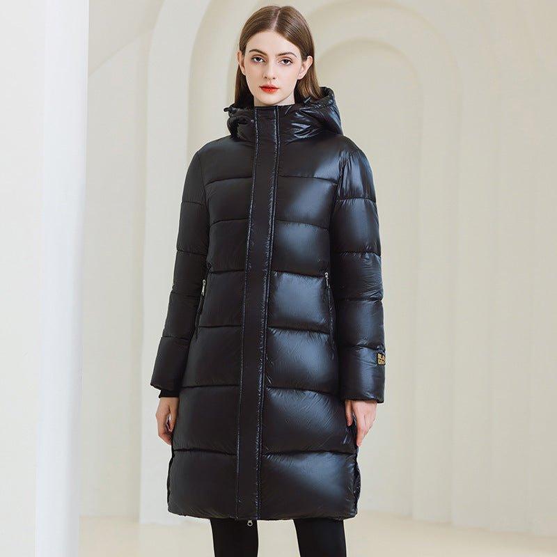 Long Hooded Winter Coat - MRC STOREJacketsMRC STOREA woman wearing a long black hooded winter coat with full - length sleeves and standing in a light - colored space.MRC STORECJWJ217303803CXBlackL