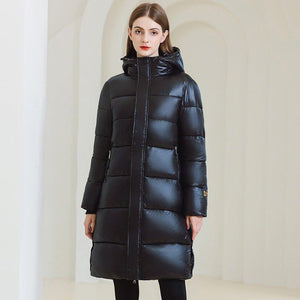 Long Hooded Winter Coat - MRC STOREJacketsMRC STOREA woman wearing a long black hooded winter coat with full - length sleeves and standing in a light - colored space.MRC STORECJWJ217303803CXBlackL