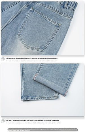 Light blue vintage men's jeans with loose straight fit, washed wide-leg denim trousers, visible stitching, and classic denim texture.