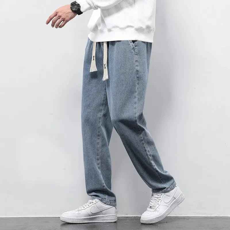 Gray wide-leg summer jeans from My Store, showcasing the relaxed fit and stylish design in a casual outdoor setting.