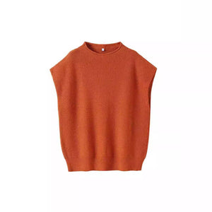 Apricot turtleneck vest sweater with an abstract pattern, stylish and cozy for layered fall or winter outfits.