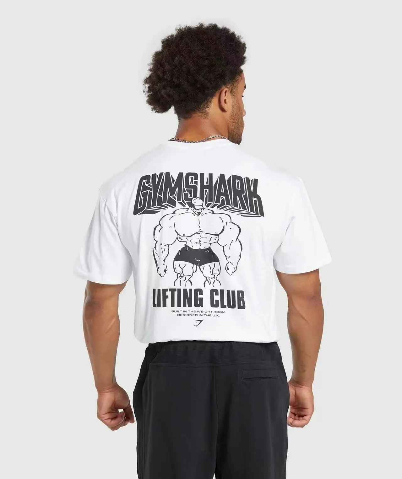 Black loose sports T-shirt from My Store featuring a shark graphic on the back, ideal for active wear and casual style.