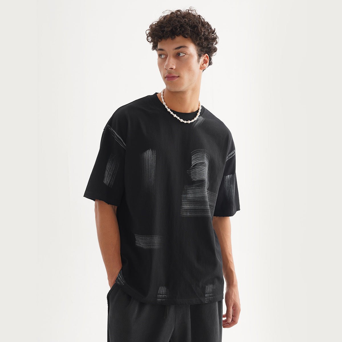 Vintage T-Shirt - Washed Loose Cotton - MRC STORET-ShirtsMy StoreA man wearing a washed black vintage t-shirt with a round neckline and short sleeves.MRC STORECJYH235349104DWBlackL
