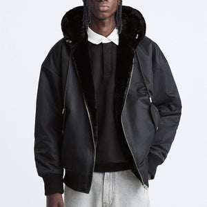 Plush Hooded Faux Fur coat - MRC STORETopMy StoreA man wearing a black hooded faux fur coat with a standing collar and stick pockets, paired with a black sweater and blue jeans.MRC STORECJXZ215759303CXBlackL