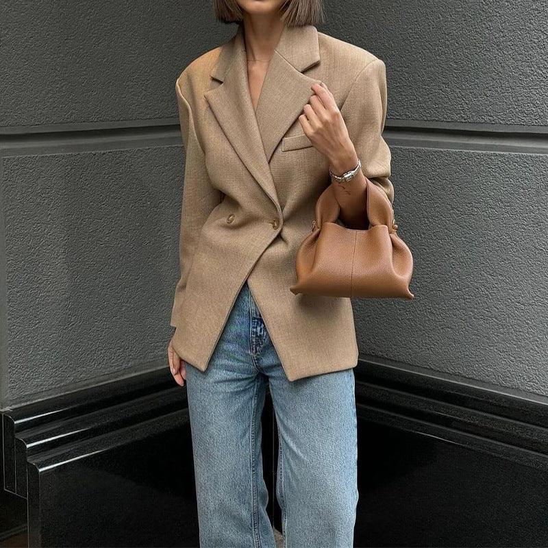 Elegant Business Suit Coat - MRC STORETopMy StoreA woman wearing a beige business suit coat with long sleeves, paired with blue jeans, carrying a brown handbag, and standing against a grey background.MRC STORECJYD211735003CXKhakiL
