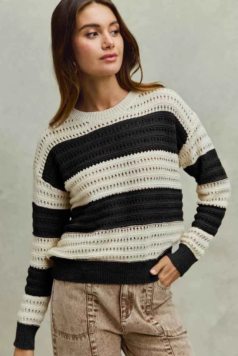 Cream and black openwork wide stripe textured sweater pullover by Trendsi, showcasing a stylish knit pattern and cozy fit.