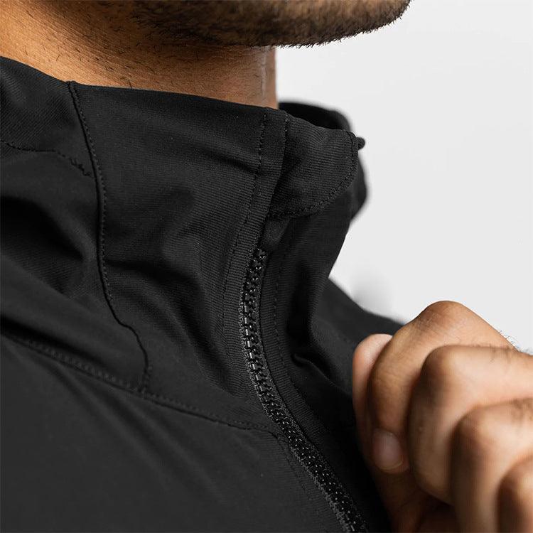 Black men's lightweight hooded windbreaker hoodie by MJ Room with front zipper pocket and adjustable drawstring hood.
