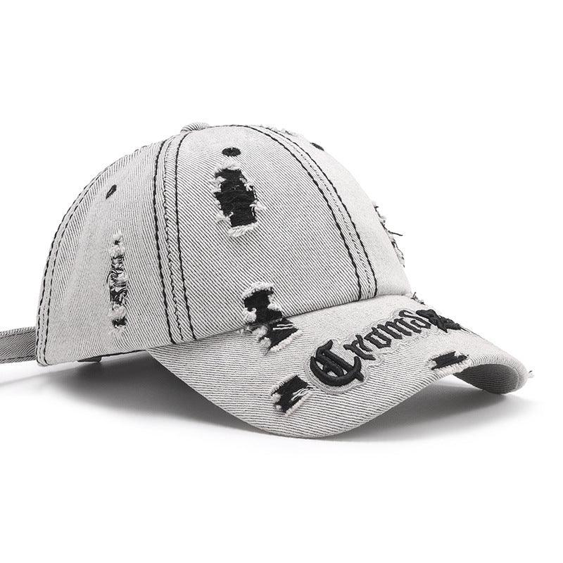 Black adjustable cotton dome hat with ripped letter print embroidery, matching accessories cap for casual style.