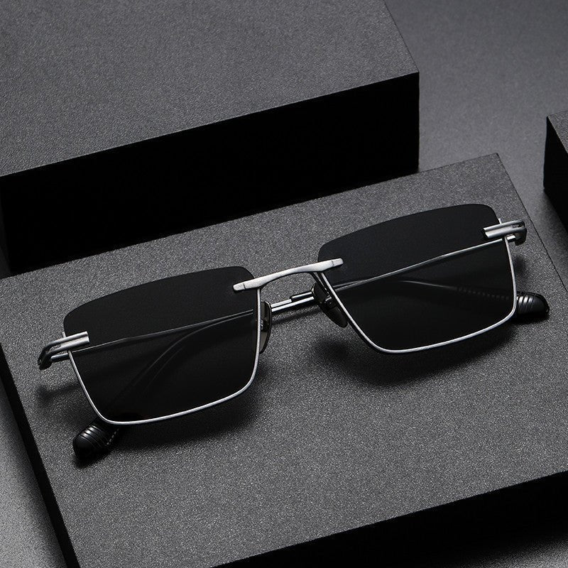 Polarized Sunglasses - UV - Proof Titanium - MRC STOREAccessoriesMy StoreA pair of women's polarized sunglasses with a black frame and grey lenses, displayed on a dark platform with a reflective surface.MRC STORECJCF201152103CXBlack Frame Black Gray