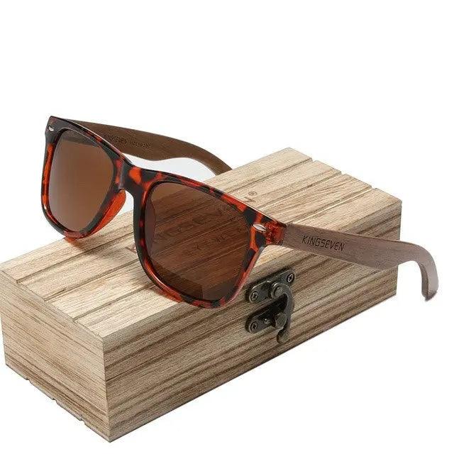 Black sports sunglasses with a cool round design, stylish accessories from My Store, displayed in a sleek wooden box.
