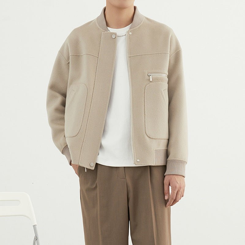 Woolen Coat - Short Baseball Style - MRC STOREJacketsMy StoreA male model wearing a beige woolen coat with long sleeves and a straight hem, paired with a white t-shirt and brown trousers.MRC STORECJXZ232889502BYBlackL