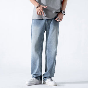 Light blue vintage men's jeans with a loose straight fit, washed finish, wide leg style, made from denim fabric.