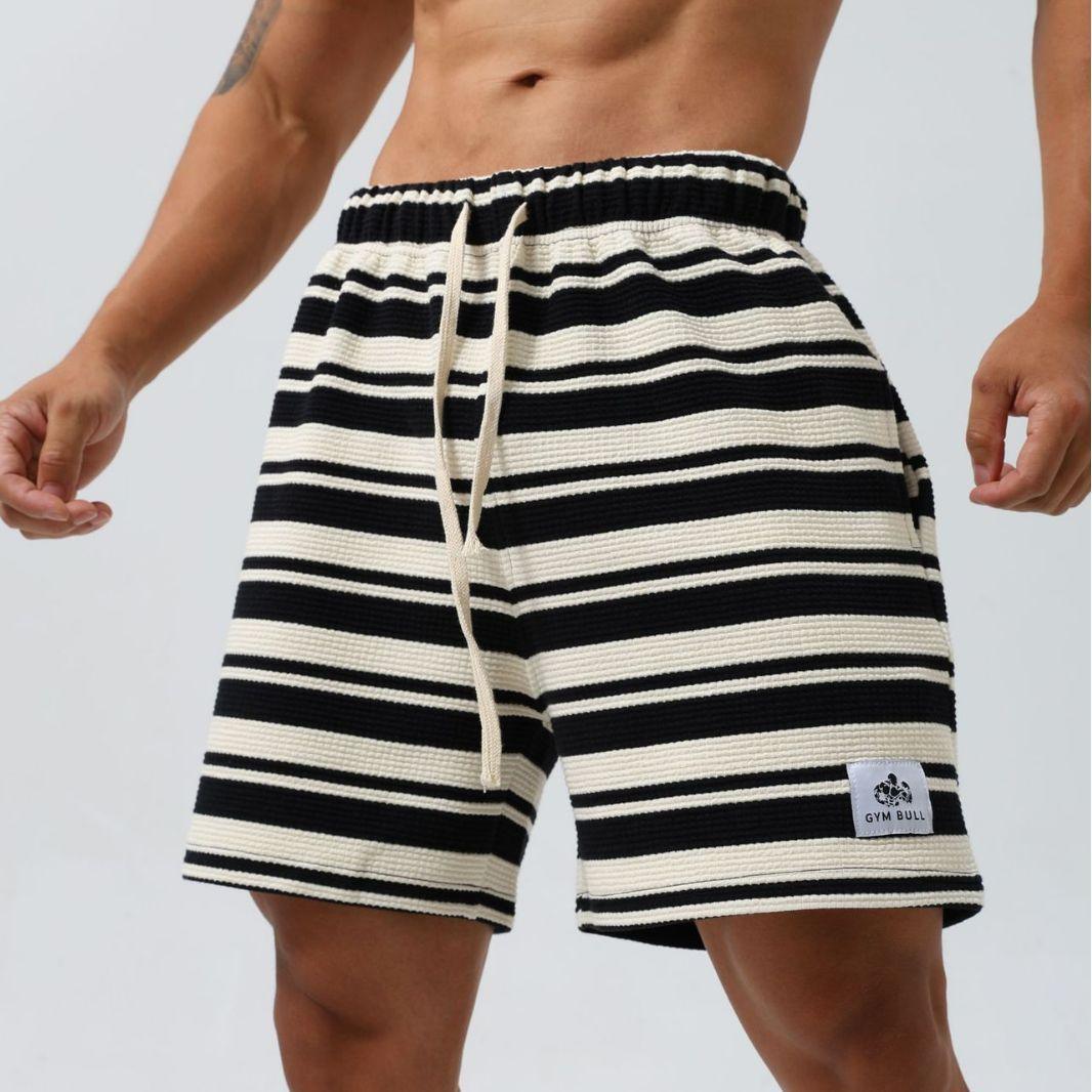 Black striped moisture-wicking sports shorts from My Store, designed for active wear and athletic comfort.