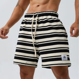 Black striped moisture-wicking sports shorts from My Store, designed for active wear and athletic comfort.