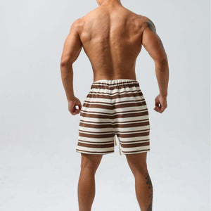 Black striped moisture-wicking sports shorts by My Store, featuring an athletic fit and breathable fabric for active wear.