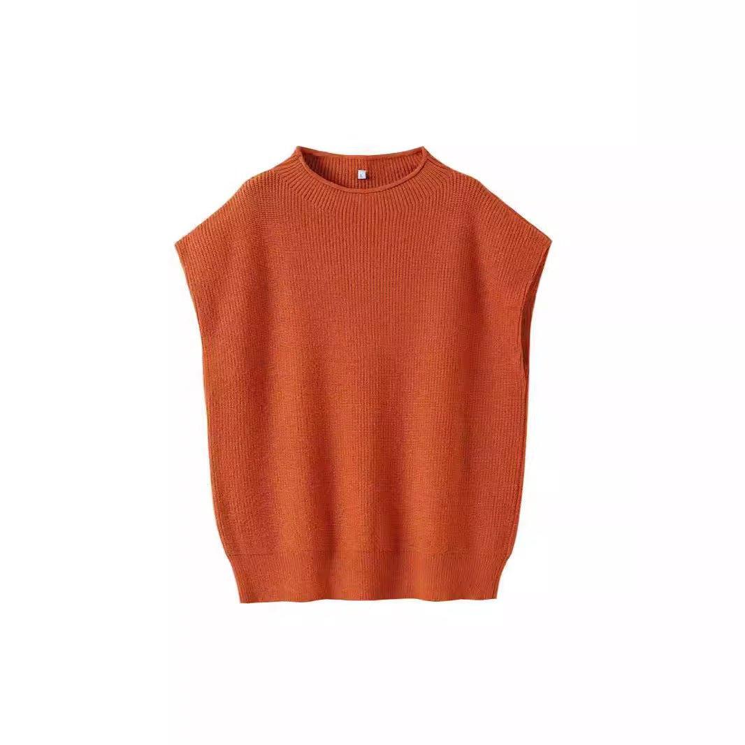 Apricot turtleneck vest sweater with an abstract pattern, stylish and cozy for layered fall or winter outfits.