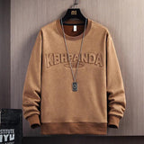 Apricot suede round neck sweater, a stylish top by My Store, displayed on a hanger showcasing its soft texture and classic design.