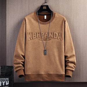 Apricot suede round neck sweater, a stylish top by My Store, displayed on a hanger showcasing its soft texture and classic design.