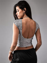 Black women's casual short sequin top with shiny embellishments, perfect for stylish daytime or evening wear.