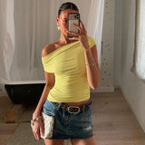 Sleeveless Top - Diagonal Collar Solid - MRC STORETopMy StoreA woman wearing a yellow sleeveless top with a diagonal collar, paired with a denim skirt and carrying a white purse.MRC STORECJCS235601503CXYellowL