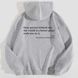 Model wearing a large gray casual hoodie with bold letter print from My Store, featuring a relaxed fit and soft fabric.